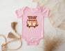 a pink baby bodysuit with two owls on it
