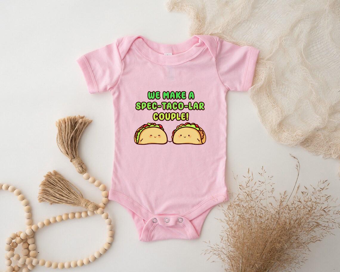 a baby bodysuit with two tacos printed on it