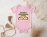 a baby bodysuit with two tacos printed on it