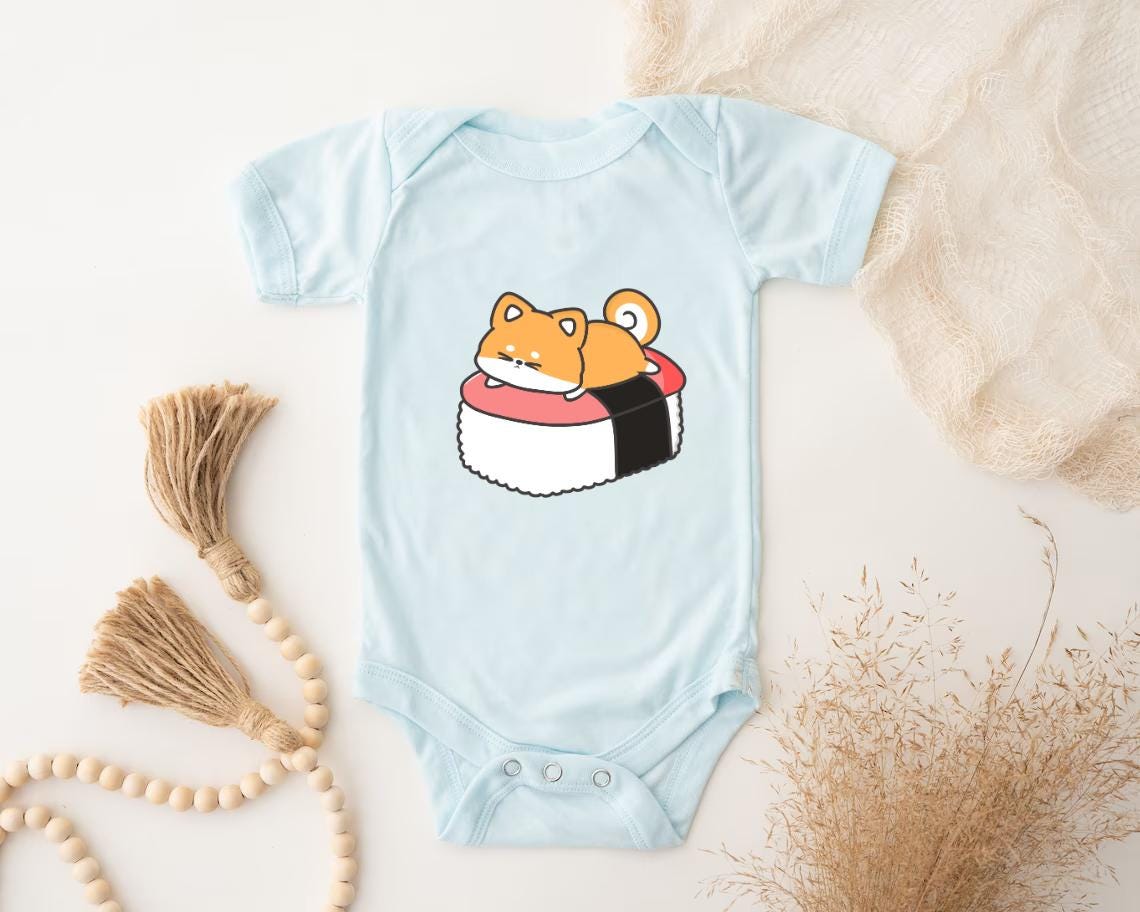 a baby bodysuit with a sushi character on it