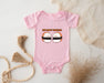 a pink baby bodysuit with two sushi sushi on it