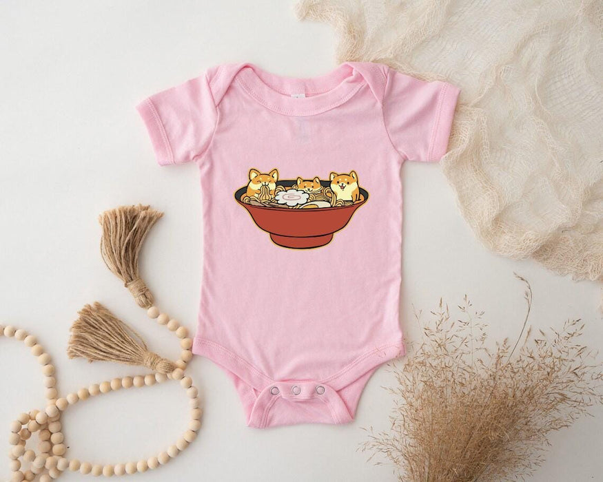 a pink bodysuit with a picture of three cats in a bowl