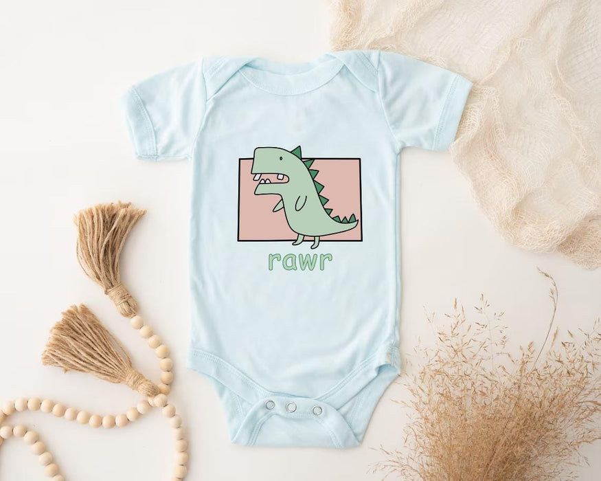 a baby bodysuit with a green dinosaur on it