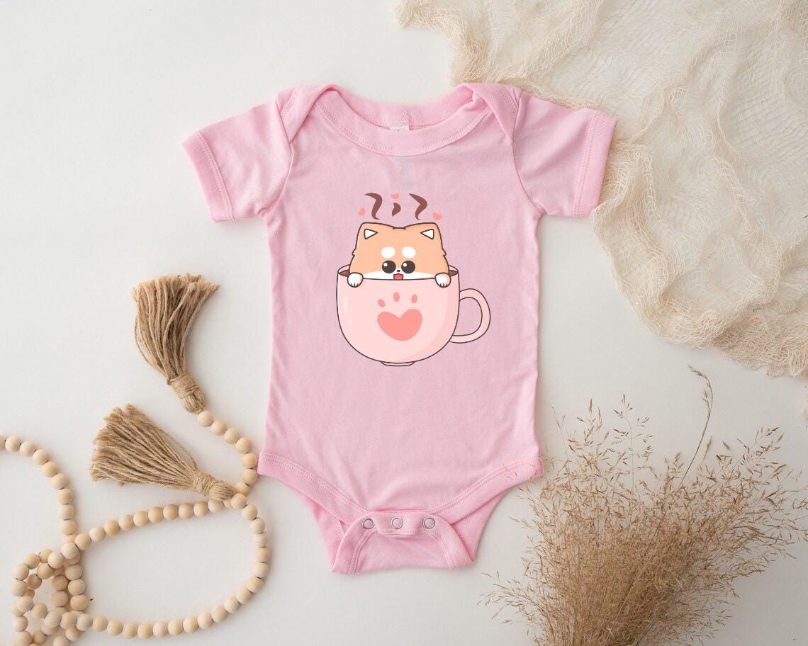 a pink baby bodysuit with a cat on it