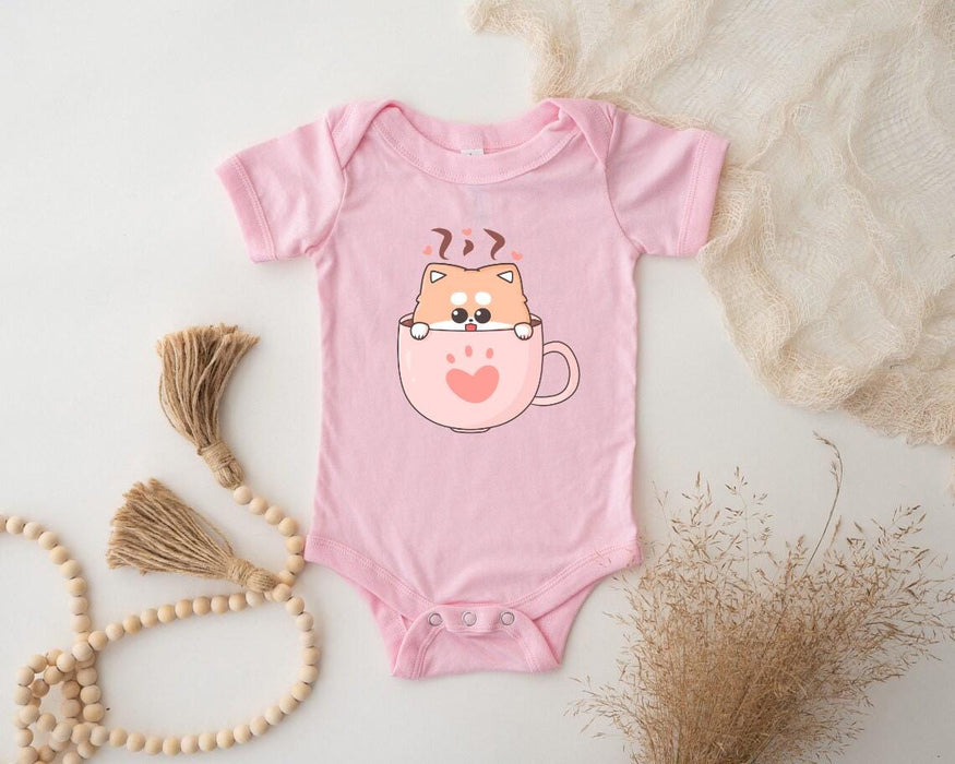 a pink baby bodysuit with a cat on it
