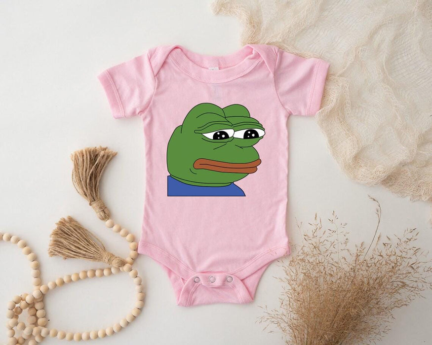 a bodysuit with a picture of a frog on it