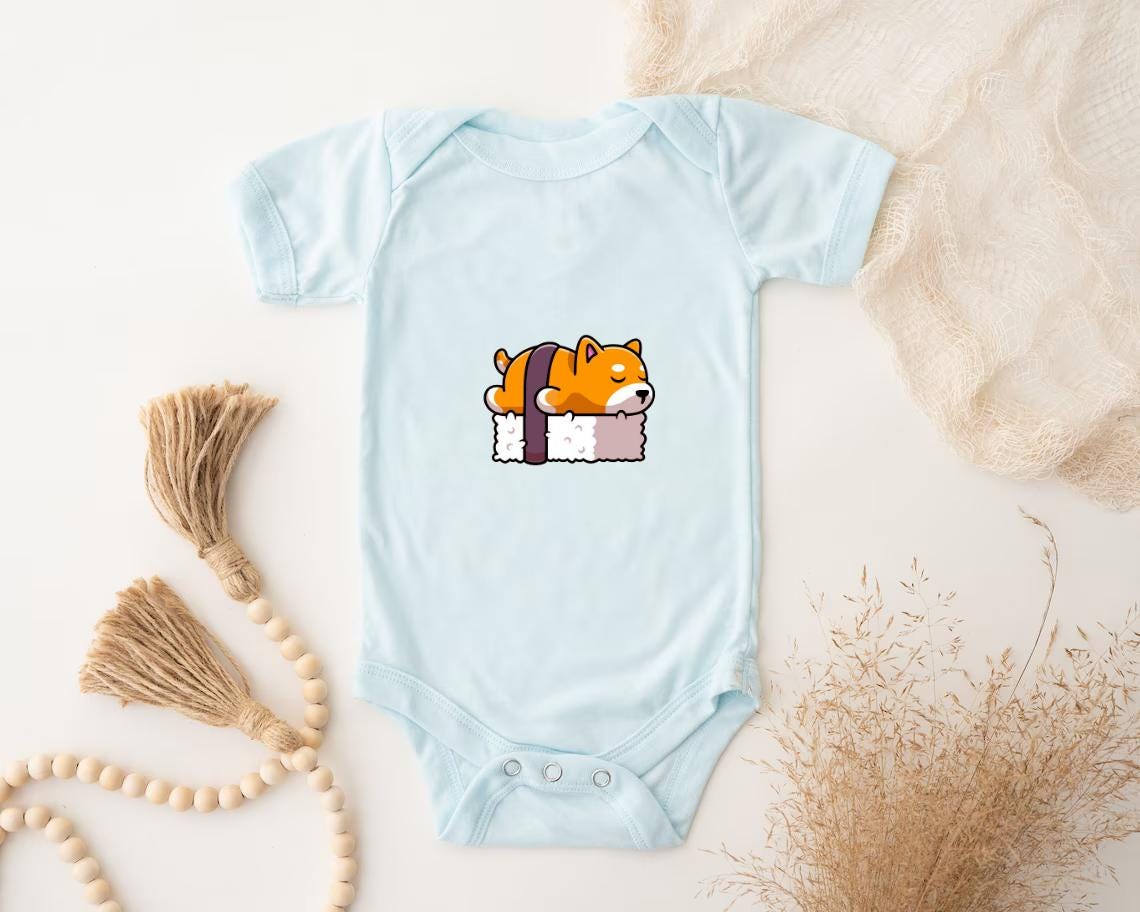 a baby bodysuit with a picture of a cat on it