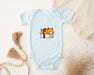 a baby bodysuit with a picture of a cat on it