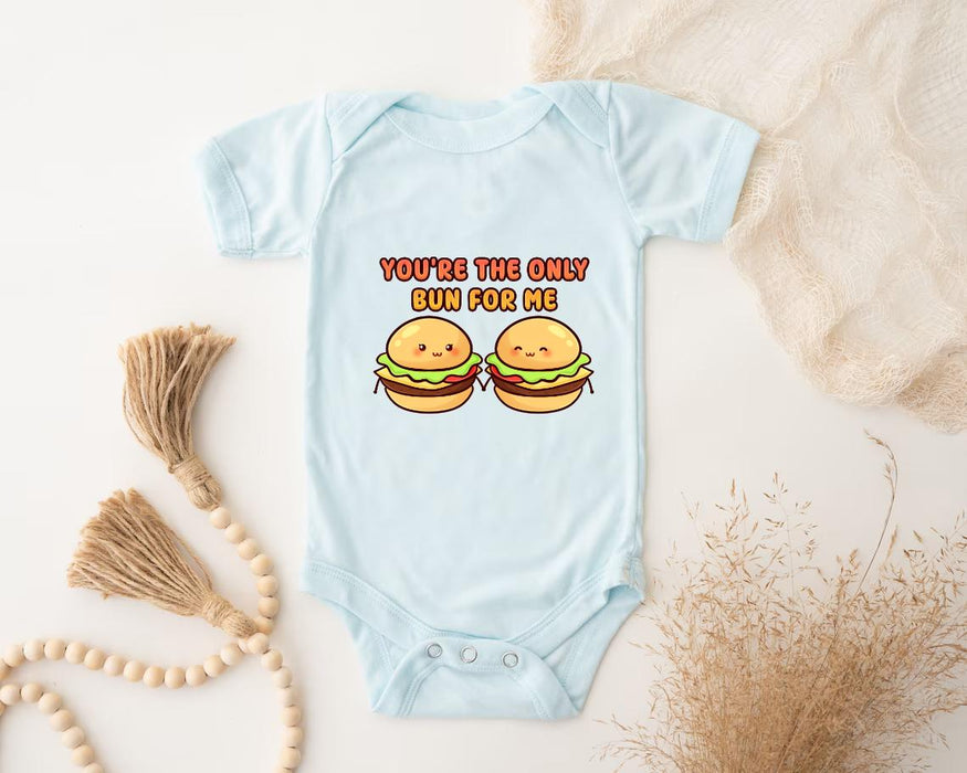 a baby bodysuit with two hamburgers on it