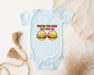 a baby bodysuit with two hamburgers on it