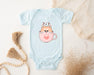 a baby bodysuit with a cat in a cup on it