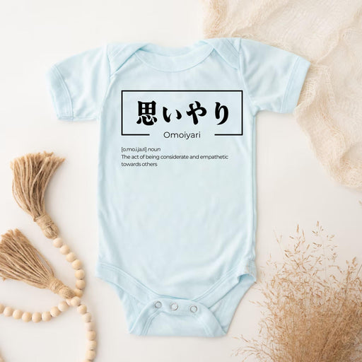 a baby blue bodysuit with the words ommuya written in japanese