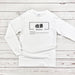 a white long - sleeved shirt with a japanese symbol on it