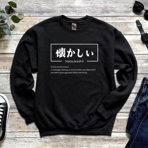 a black sweatshirt with japanese characters on it