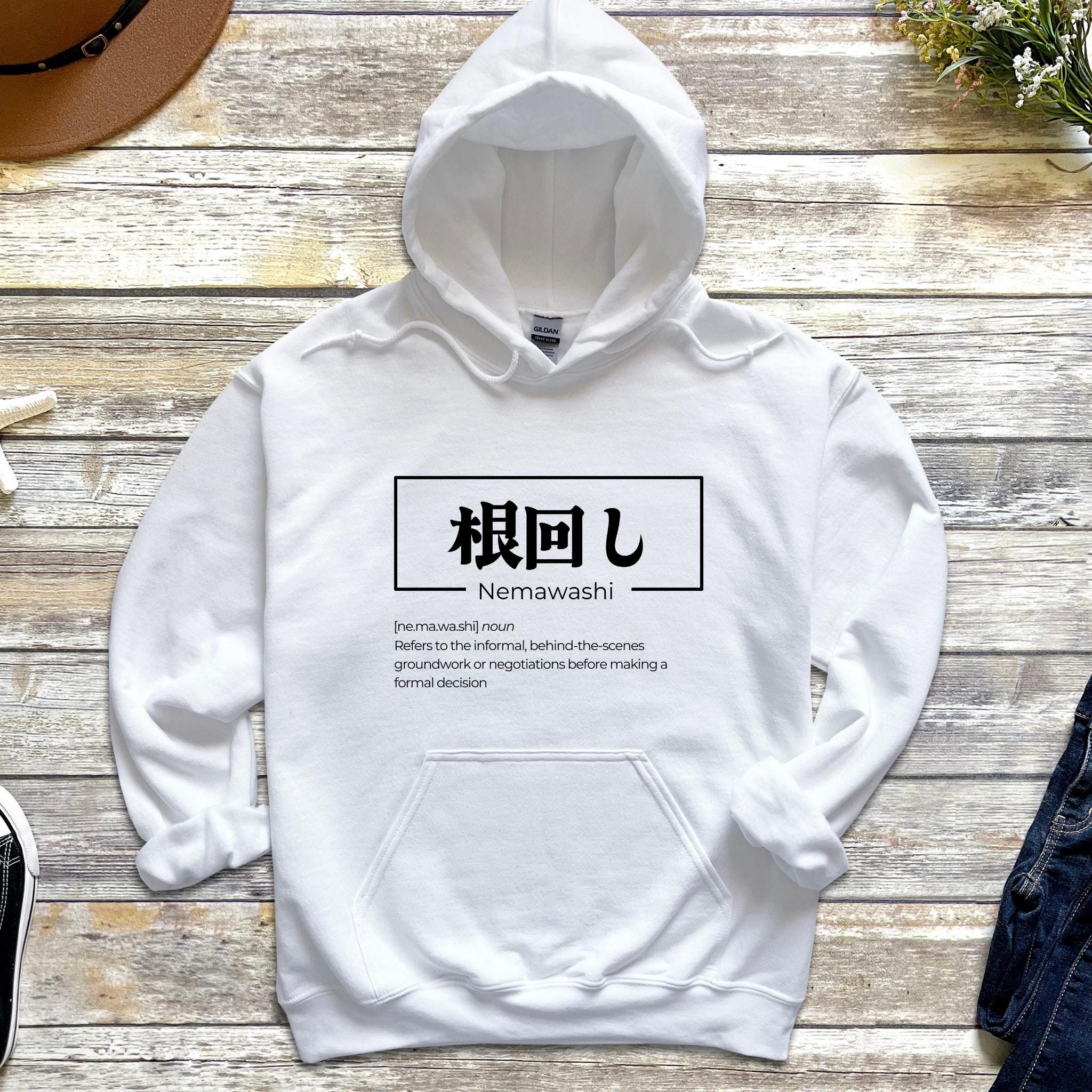 a white hoodie with japanese characters on it