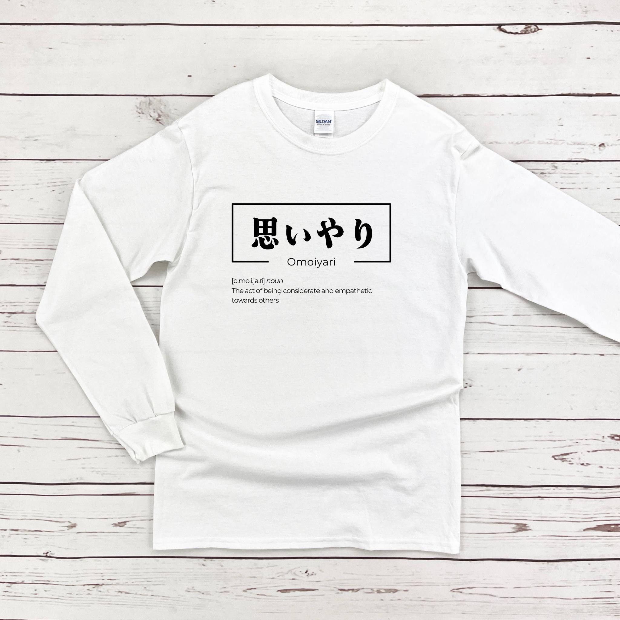 a white long - sleeved shirt with japanese characters on it