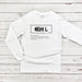 a white long - sleeved shirt with the words j in chinese