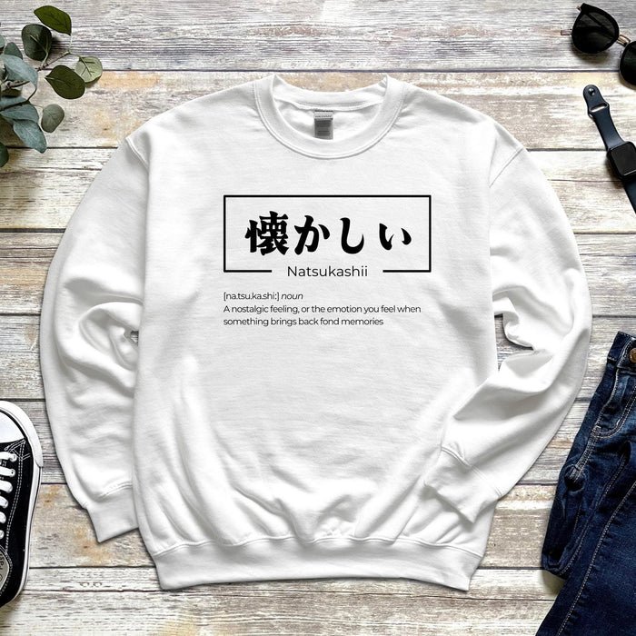a white sweatshirt with japanese characters on it