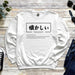 a white sweatshirt with japanese characters on it
