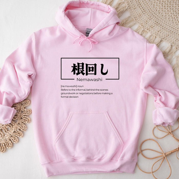 a pink hoodie with japanese characters on it
