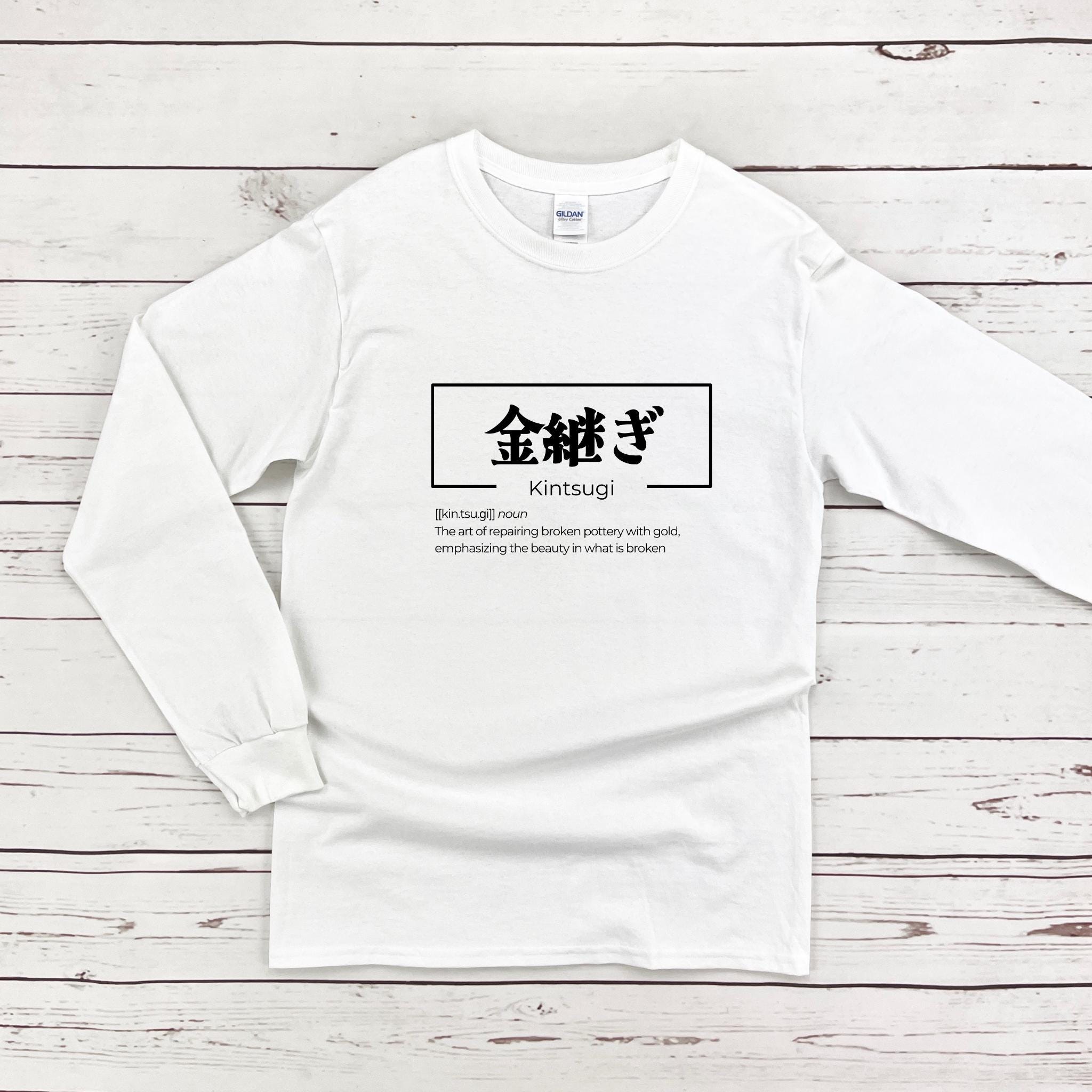 a white long sleeve shirt with chinese characters on it