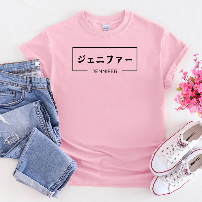 a pink shirt with japanese characters on it