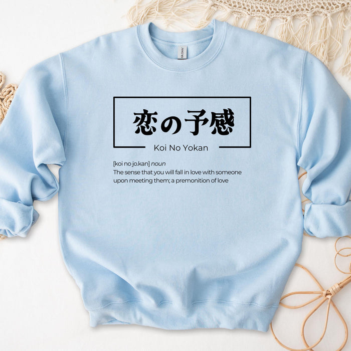 a blue sweatshirt with a japanese writing on it
