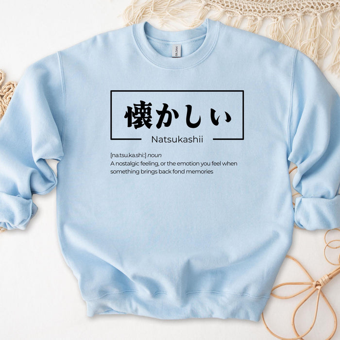 a blue sweatshirt with japanese writing on it