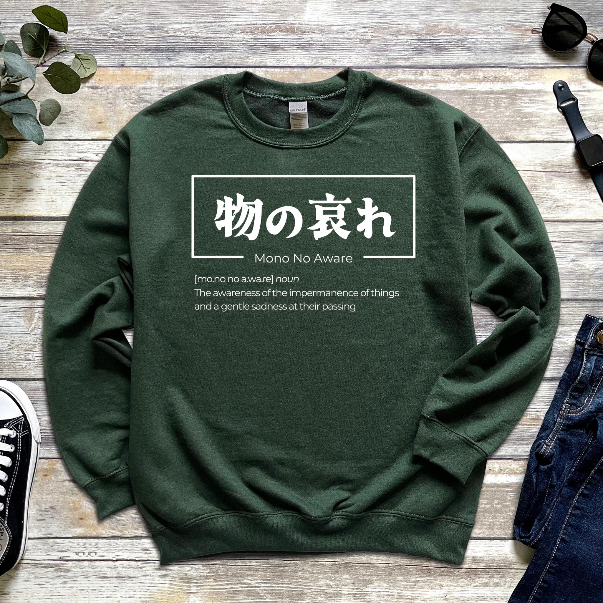 a green sweatshirt with japanese writing on it