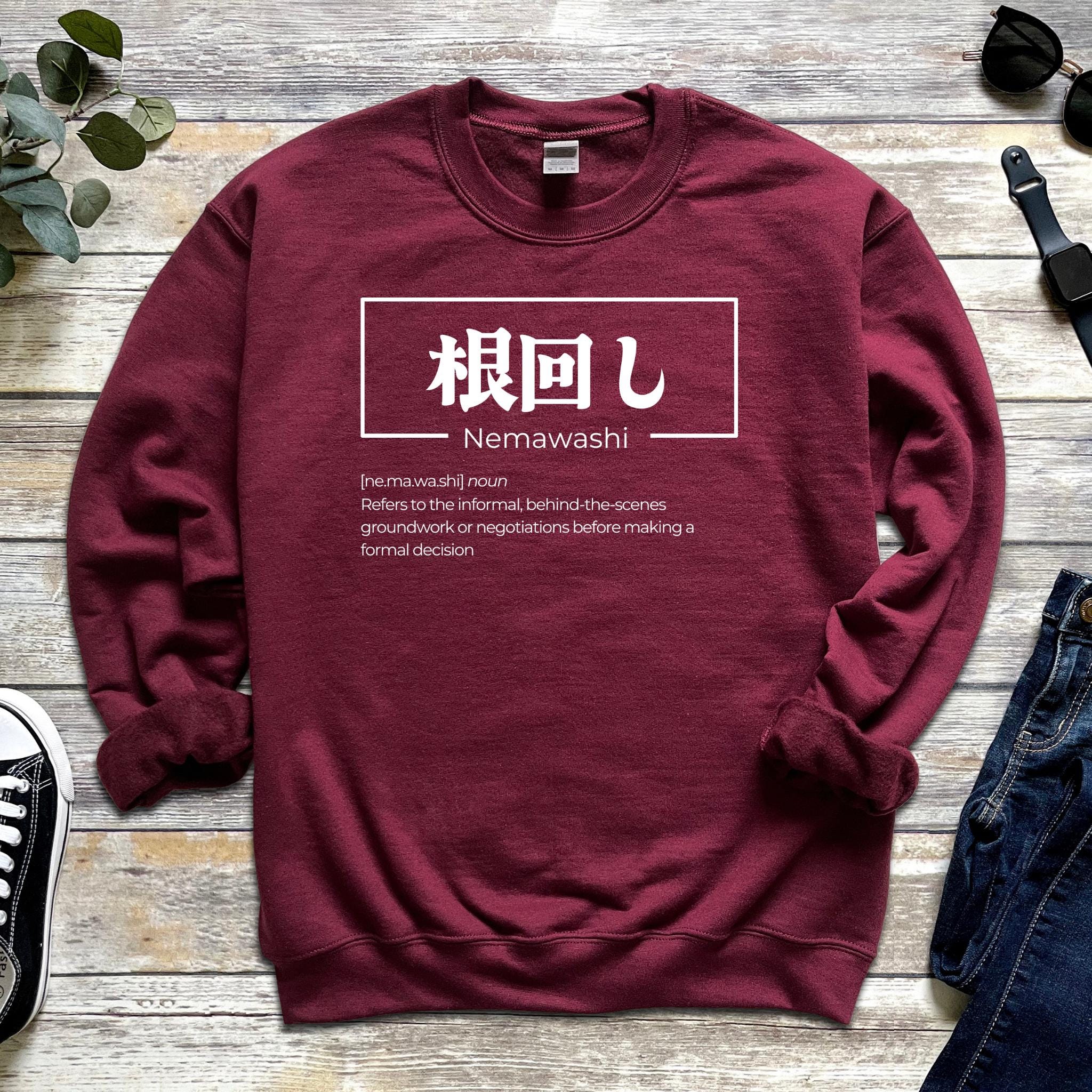 a red sweatshirt with the words nemwah written in chinese