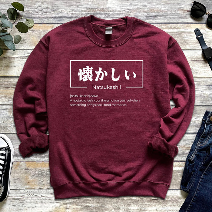 a red sweatshirt with japanese writing on it