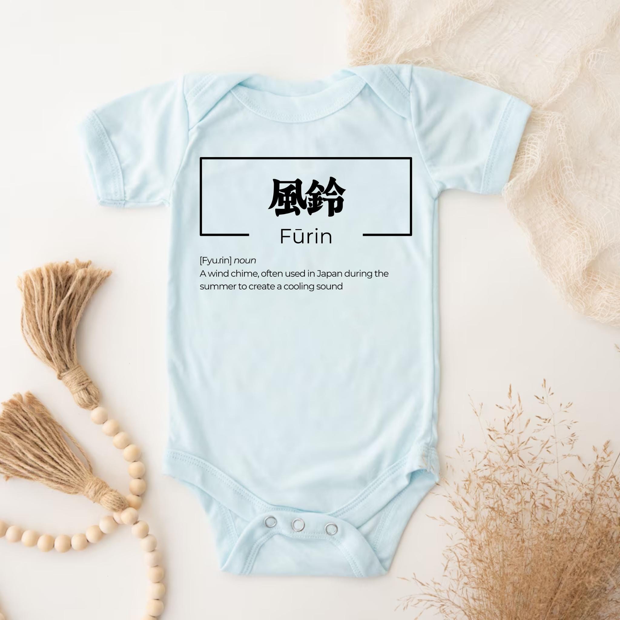 a baby blue bodysuit with the word furm written in chinese