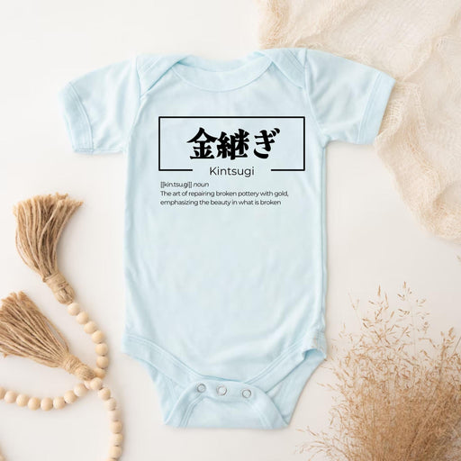 a baby bodysuit with chinese characters on it