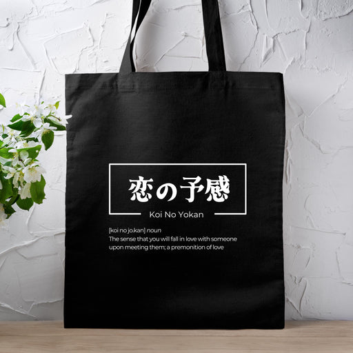 a black tote bag with a picture of kanji no yolan written in