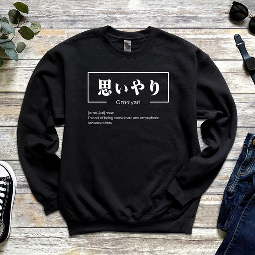 a black sweatshirt with the words omgyhi written in japanese