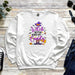 a white sweatshirt with a witch saying on it