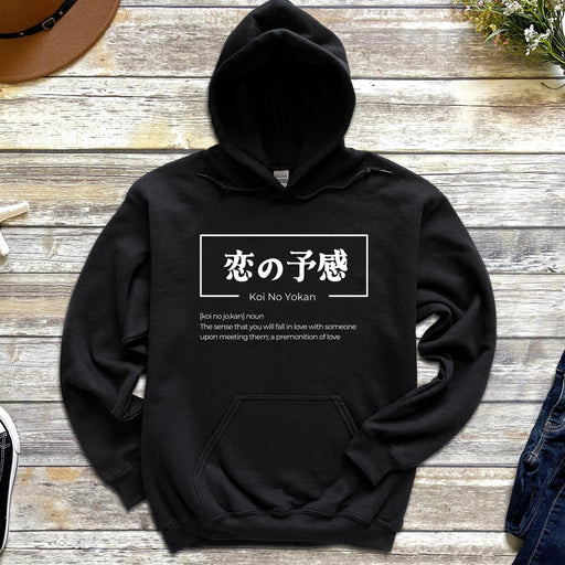 a black hoodie with japanese writing on it