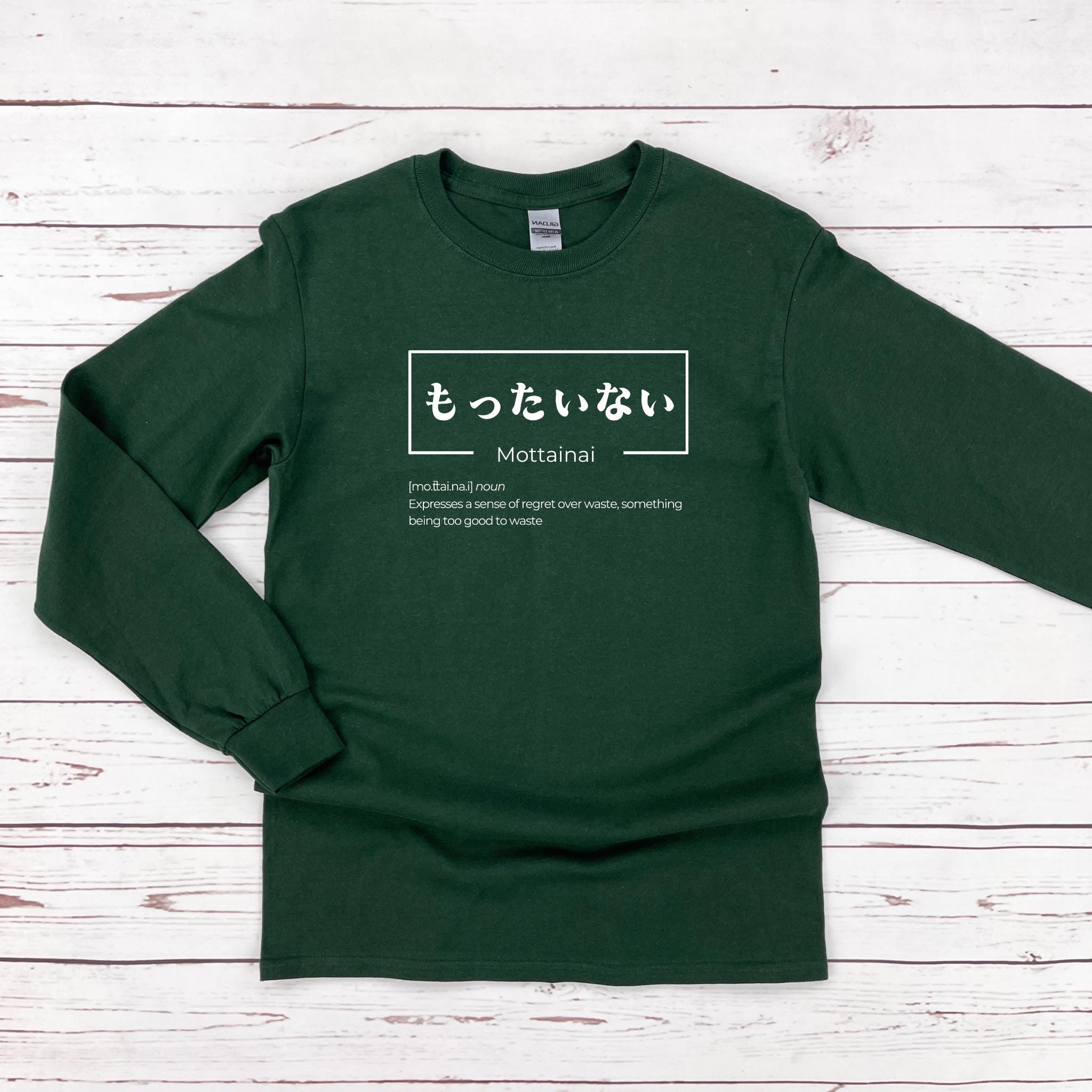 a green long sleeve shirt with japanese writing on it