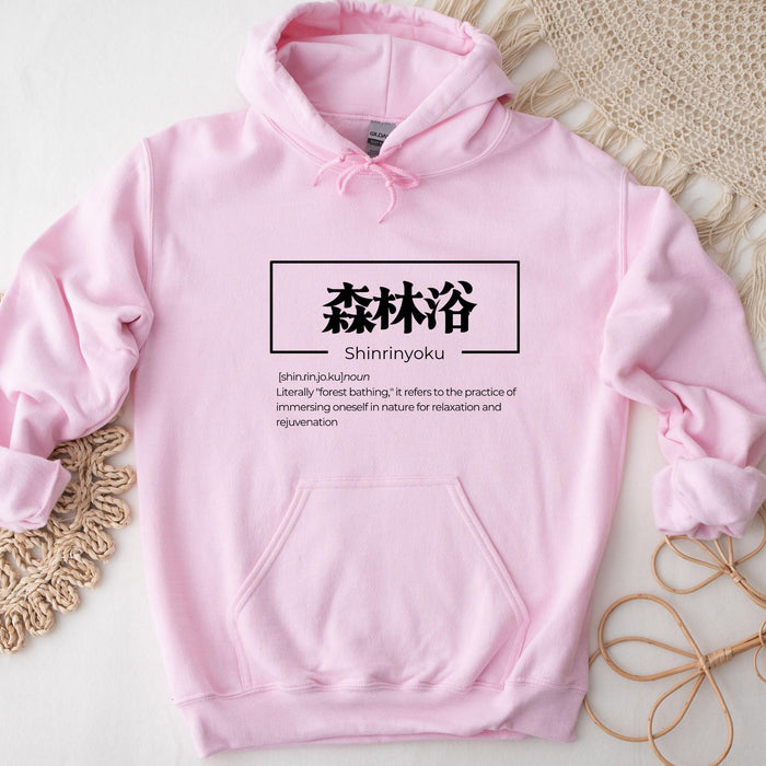 a pink hoodie with chinese characters on it