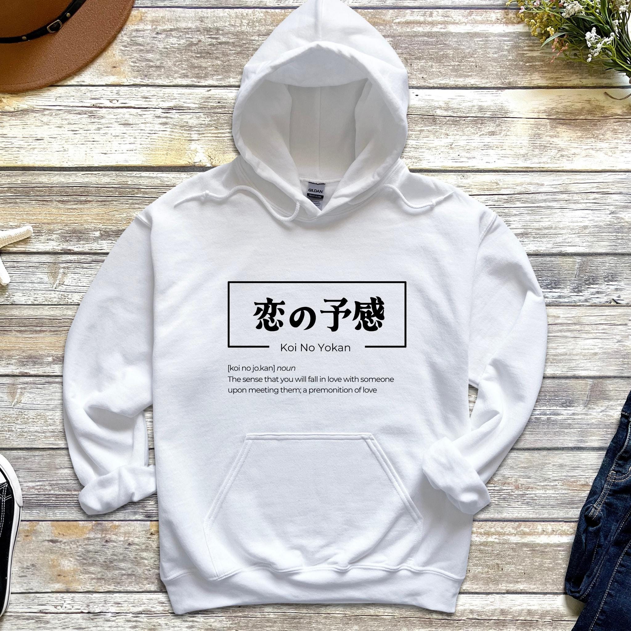 a white hoodie with japanese writing on it