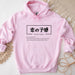 a pink hoodie with chinese characters on it