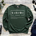 a green sweatshirt with japanese writing on it