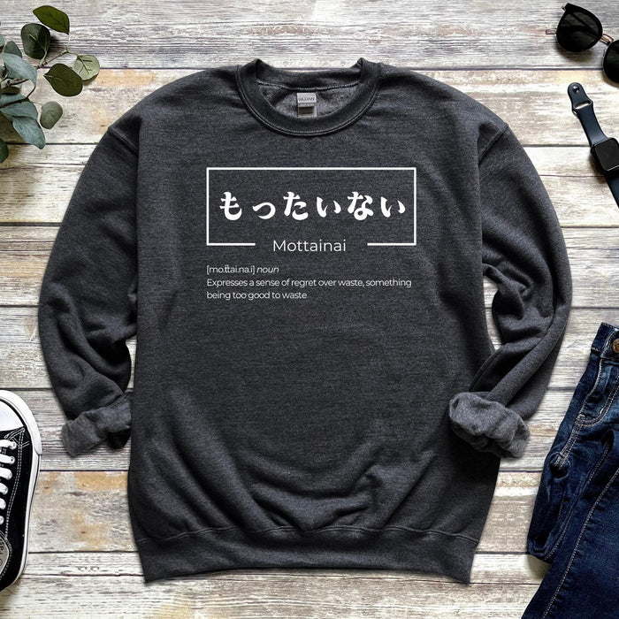 a sweatshirt with japanese writing on it next to a pair of jeans