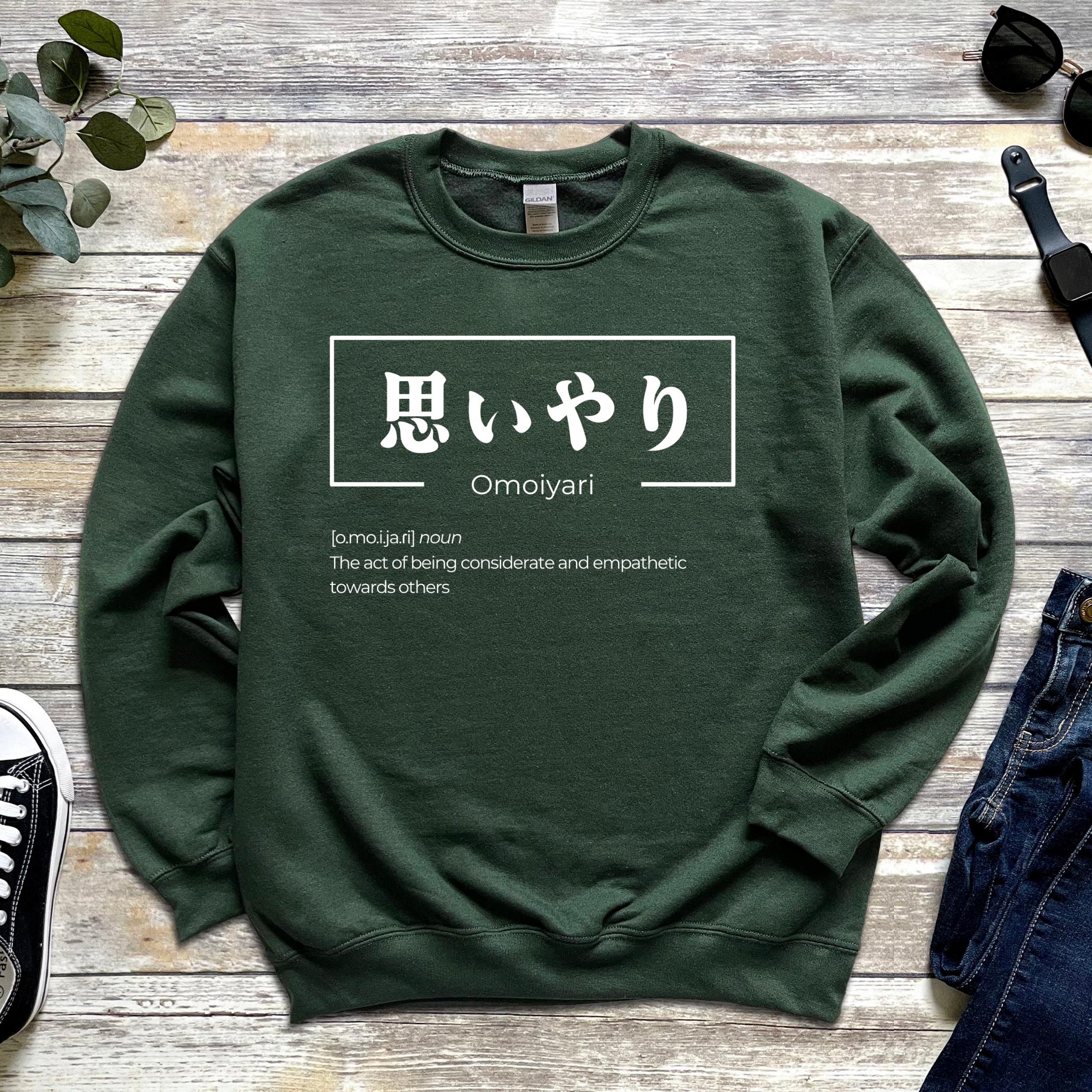 a green sweatshirt with an asian writing on it