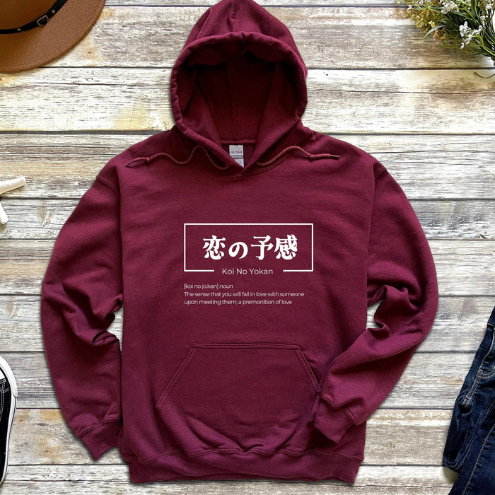a maroon hoodie with chinese characters on it
