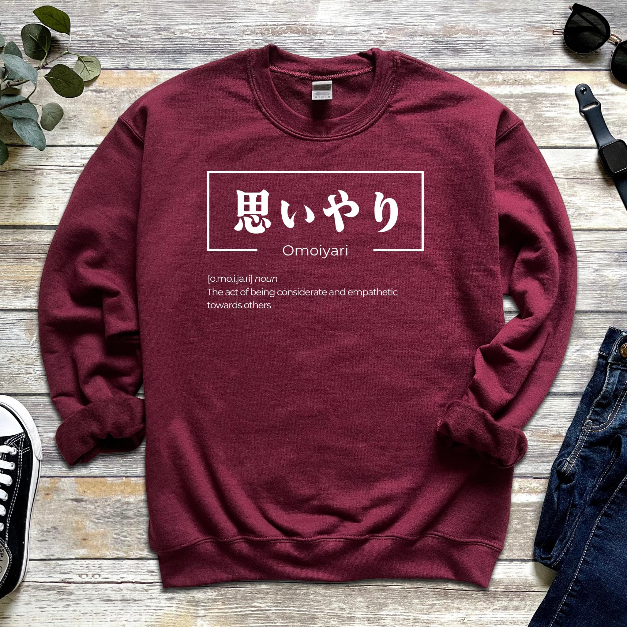a red sweatshirt with japanese characters on it