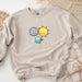 a sweatshirt with a picture of the earth and sun on it