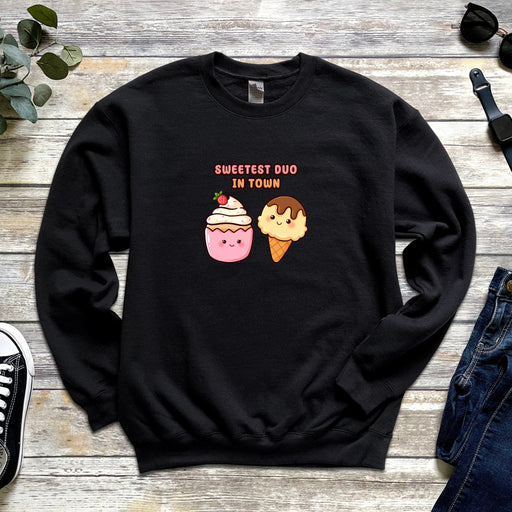 a black sweatshirt with two ice cream cones on it