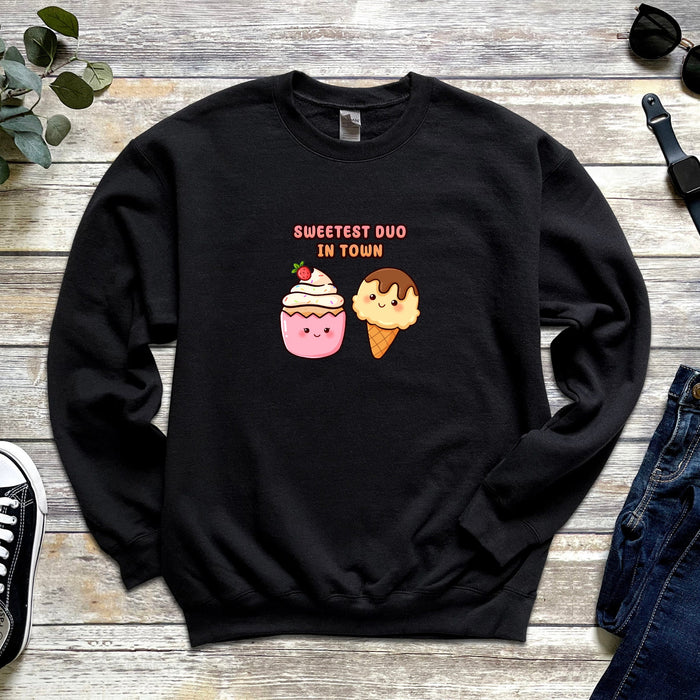 a black sweatshirt with two ice cream cones on it