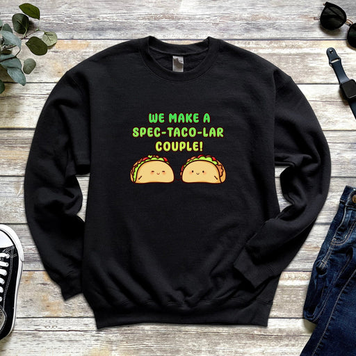 a black sweatshirt with two tacos on it